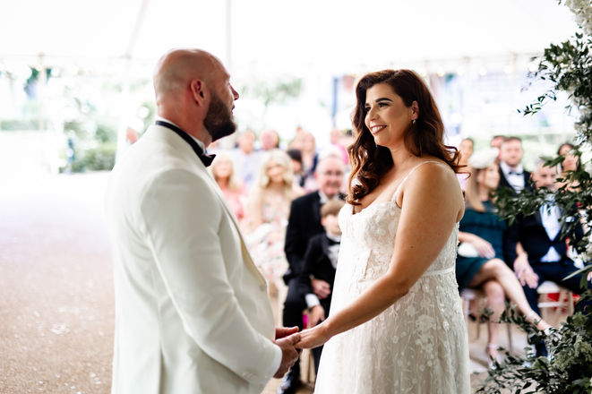 First look moment between couple during ceremony at Houchins