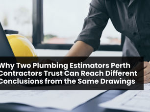 Estimator checking plumbing takeoff layouts on a laptop with a hard hat nearby.