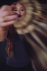Beauty branding photography for independent stylists, featuring hair extension artists in studio with modern, minimal styling.