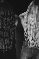 Beauty branding photography for independent stylists, featuring hair extension artists in studio with modern, minimal styling.