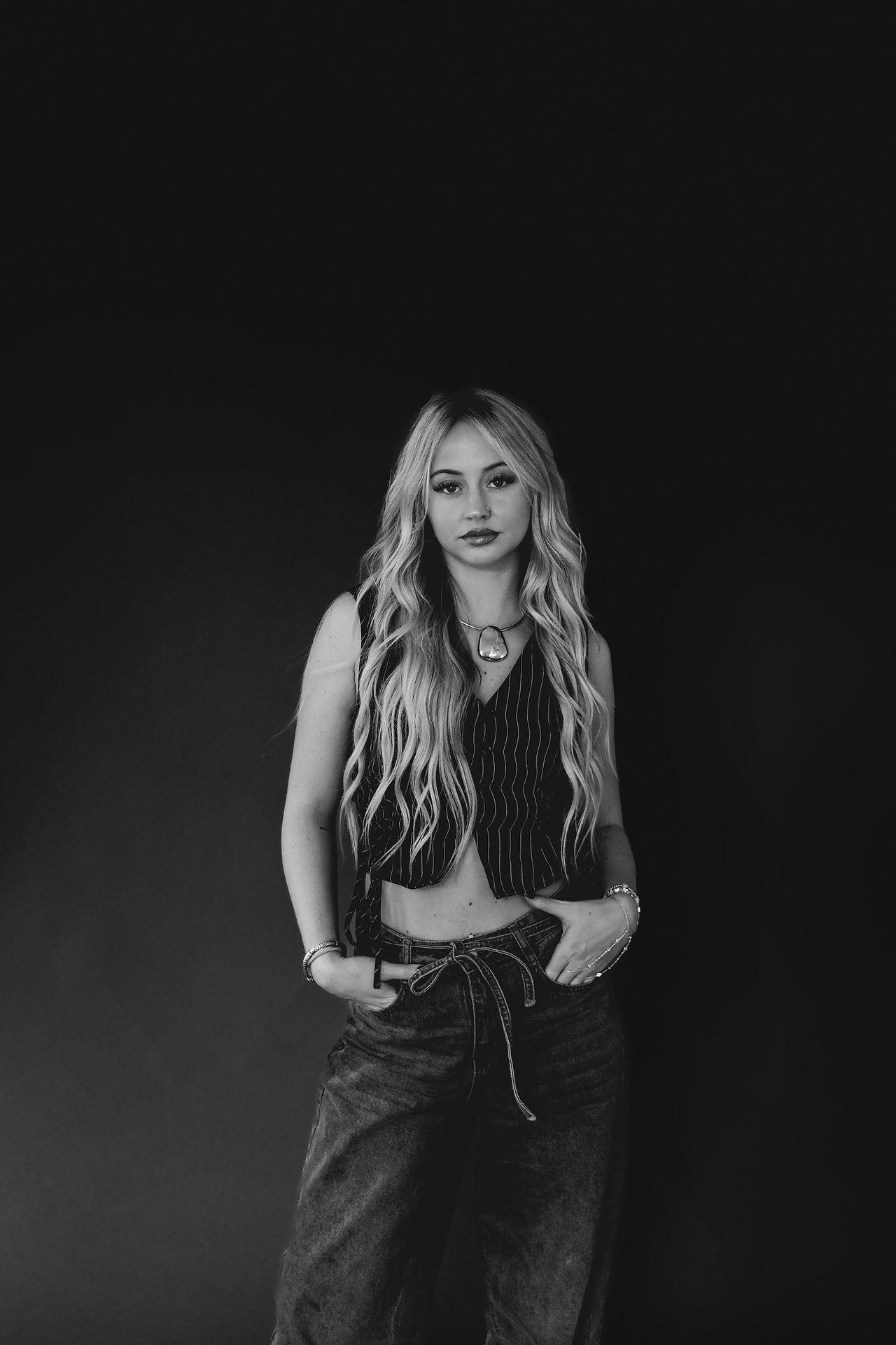 Beauty branding photography for independent stylists, featuring hair extension artists in studio with modern, minimal styling.
