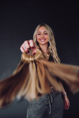 Professional brand session for two hairstylists specializing in luxury hair extensions, photographed in a modern studio setting in Carmel.