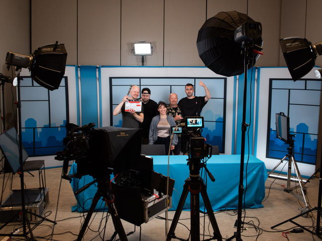 Professional interview video production setup in Helsinki with cinema cameras and studio lighting.