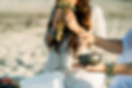 zoomed in view of a singing bowl with other musical instrument blurred in the background