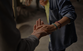 Two People Reaching out
