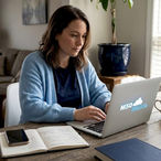 Small business owner writing marketing email at home