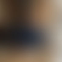 Small business owner reviews channels at café