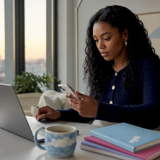 Marketing professional reviewing call to action campaign on smartphone