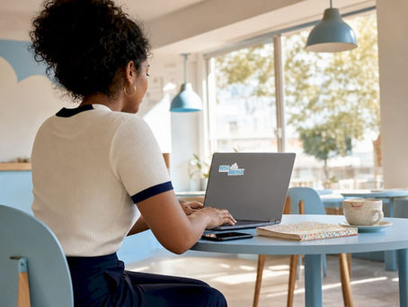 Micro-influencer reviewing social media data at home desk