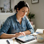 Small business owner reviewing analytics at home