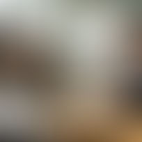 Team discussing branding around cluttered table