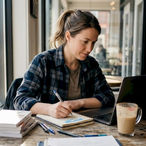 Small business owner working in café