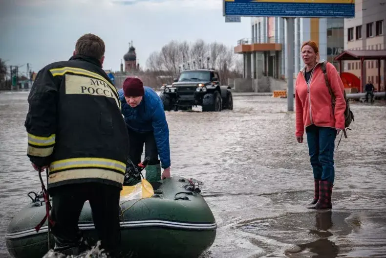 Search-and-rescue teams use an inflatable boat after the dam burst in Orsk, Russia, on April 19, 2024. Russian environmentalists are sounding the alarm about a radioactive leak threat as floodwaters head toward a uranium mine in the region of Kurgan in Russia's Urals mountains
