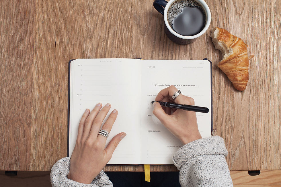 A woman writing in a notebook