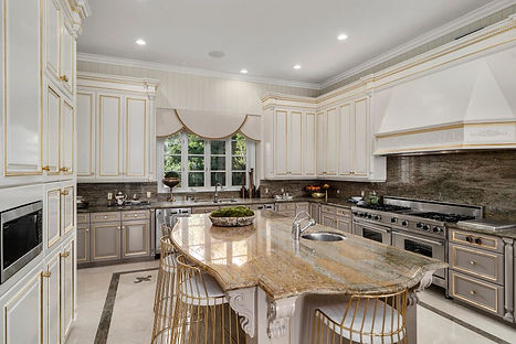 Stylish classic kitchen with crown molding and detailed woodwork, bringing sophistication and timeless appeal to the space