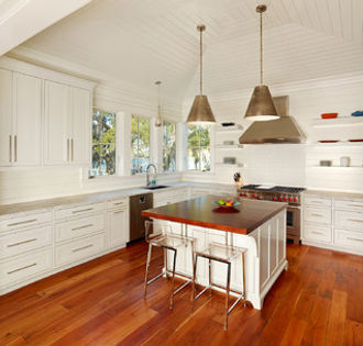 Elegant table-style kitchen island that combines dining and cooking areas with a classic design.