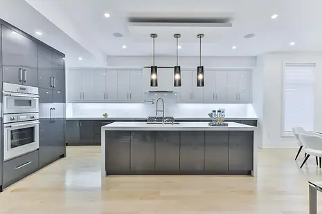 Contemporary kitchen featuring minimalist cabinetry, high-end appliances, and a clean, open layout.