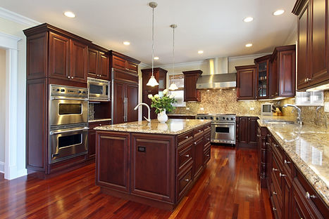 Elegant kitchen design with antique-style finishes, ornate cabinet handles, and vintage appliances for a nostalgic feel
