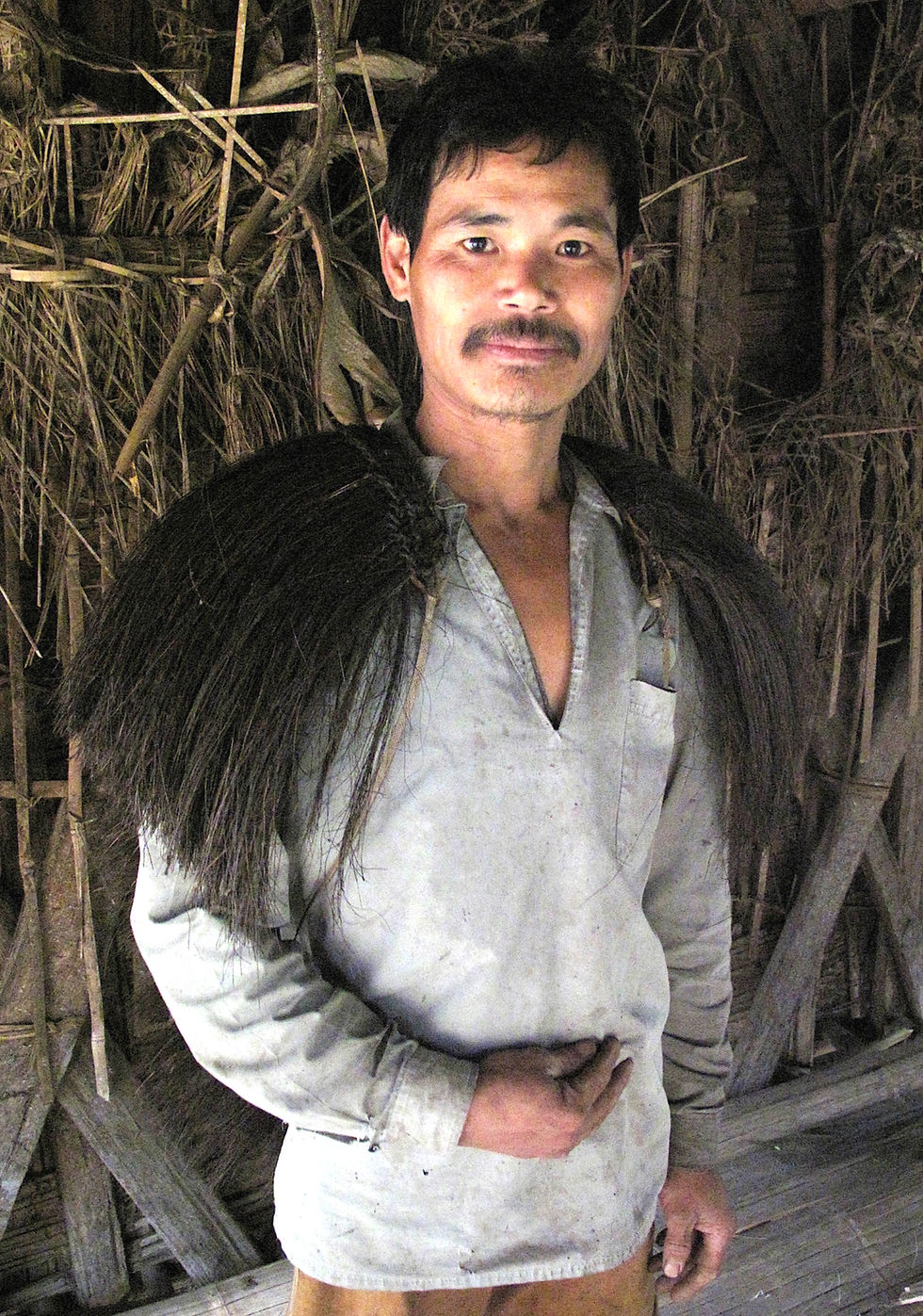Miniatyrbild: Rain cape of palm fiber