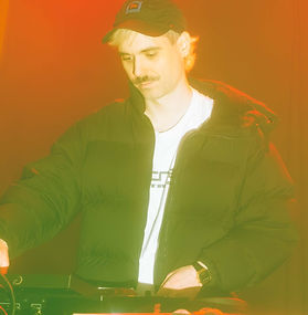 Crime DJ set in a dark rave-like club space