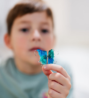 boy-wear-dental-orthodontic-plate-for-teeth-ortho-2023-11-27-05-35-00-utc.jpg