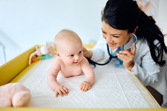 smiling-baby-during-a-visit-at-pediatrician-2023-11-27-05-06-17-utc.jpg