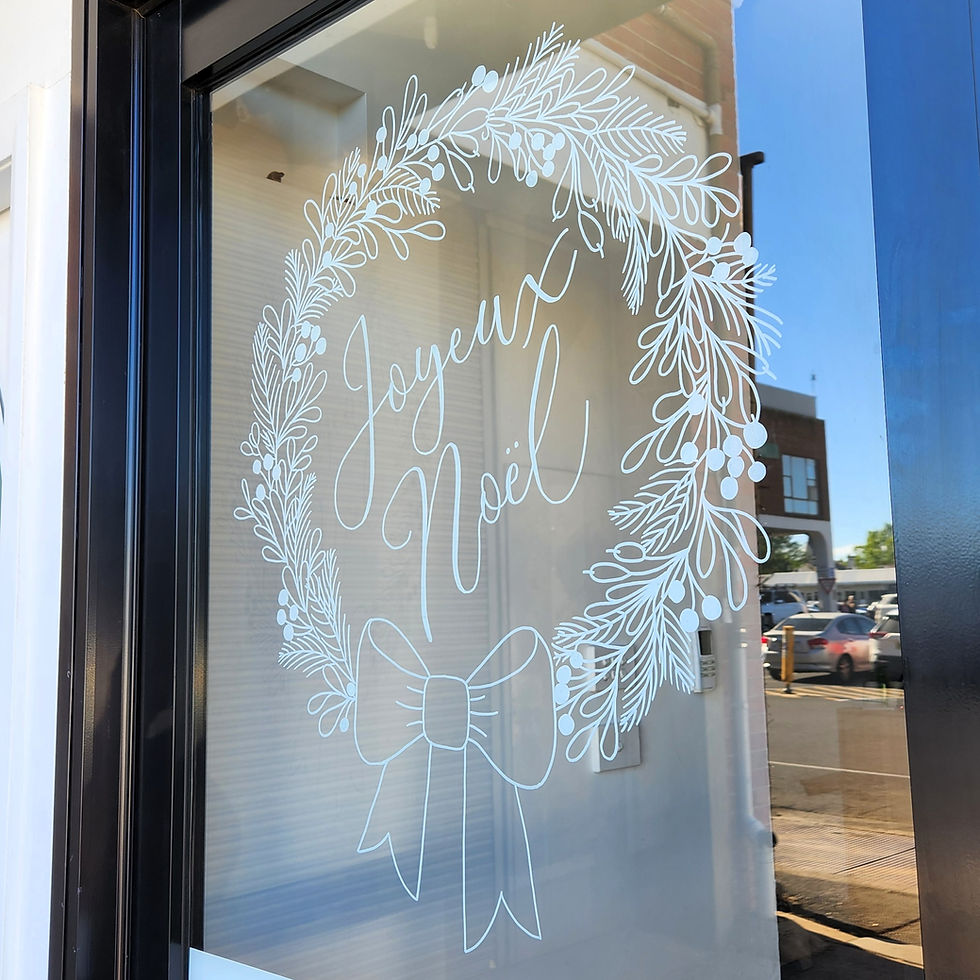White hand drawn window art