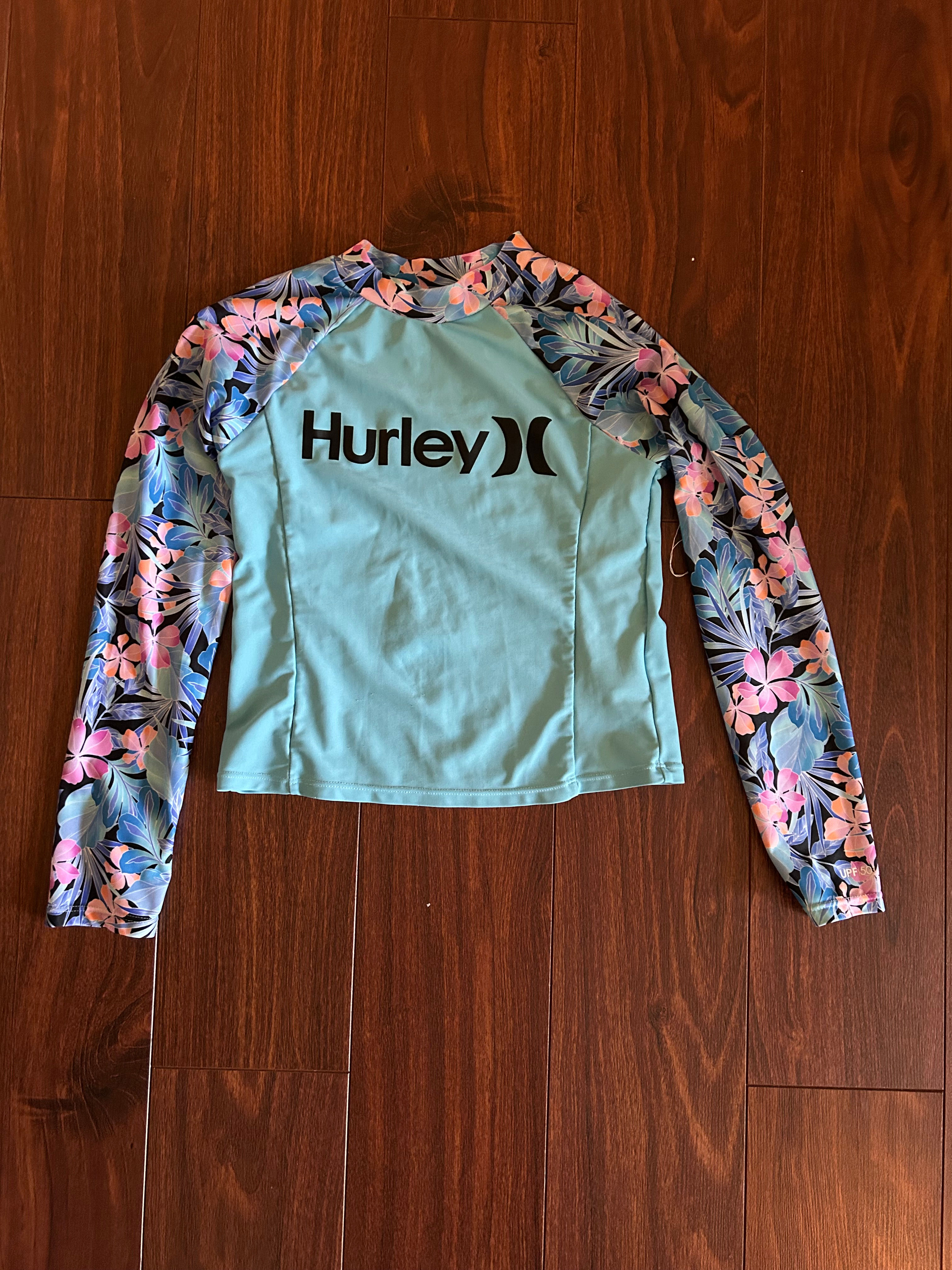 Girls blue flowered long sleeved rash guard size Y-medium