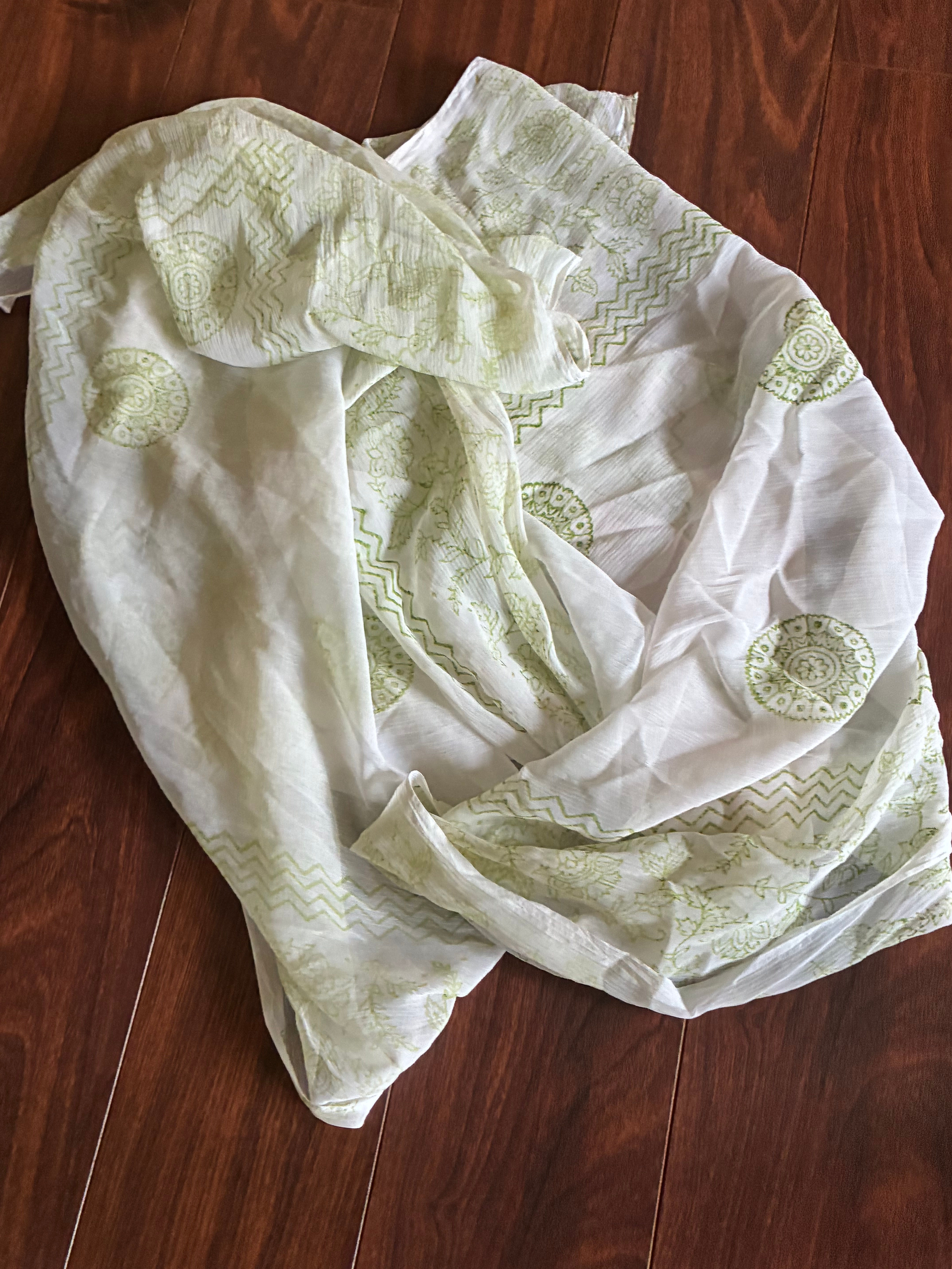 Green and white patterned scarf