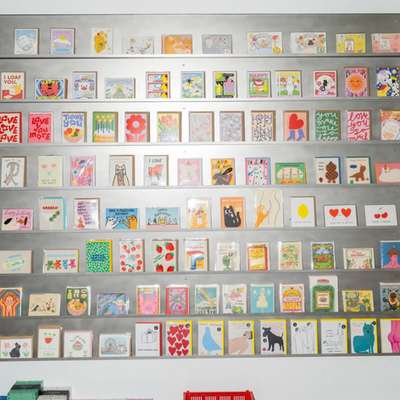 A wall of colourful greeting cards displayed inside Hands in Newtown, one of the best gift shops in Sydney.
