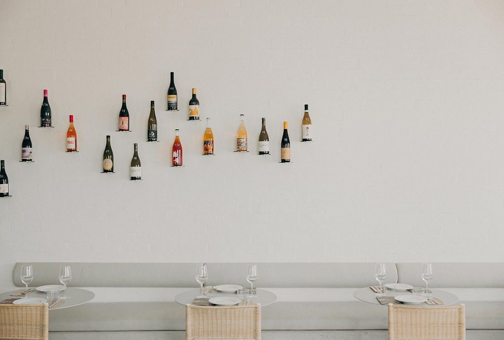 Effie’s interior with wine bottles displayed along the wall, showcasing one of the best wine bars in Sydney.