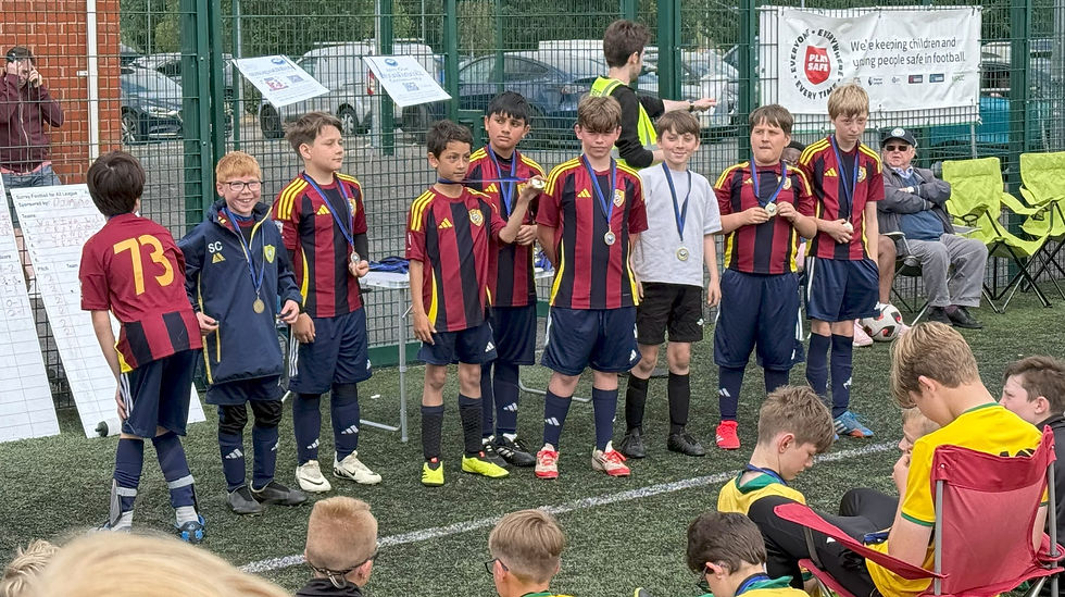 The Under-12s collect their medals