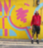 Creative Alex Noble in Margate next to his mural