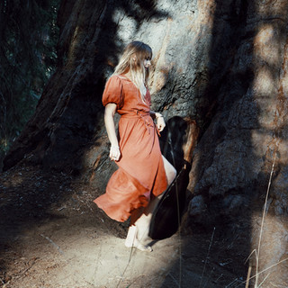 Elizabeth Flynn walking through the forest before yoga