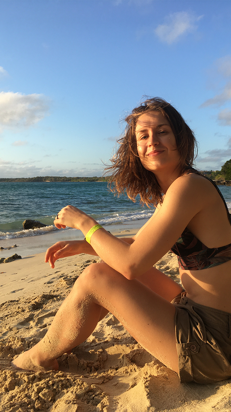 Egle Plytnikaite on the coastline of a European town