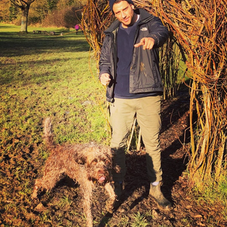 George Peace walking his dog in the countryside during the lockdown