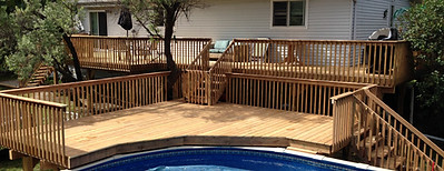 Wood poolside deck with custom railings – multi-level deck build by Country Comfort Contracting