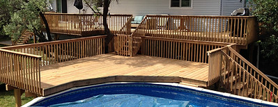 Wraparound wood deck with railings and built-in seating – outdoor living upgrade