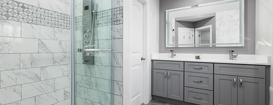 Updated bathroom with glass shower and double vanity