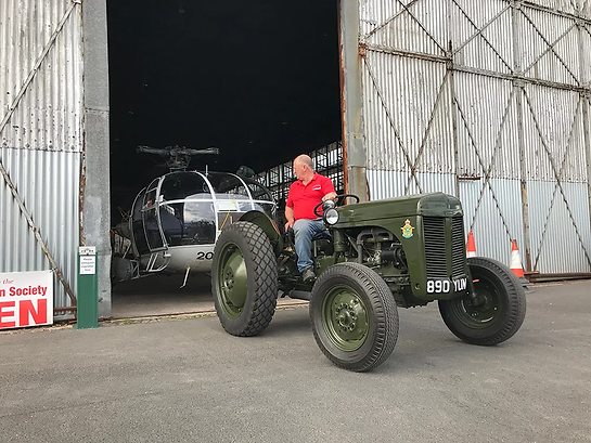 Ferguson TEA-20 Tractor towing Alouette III helicopter out of Ulster Aviation Society's hangar