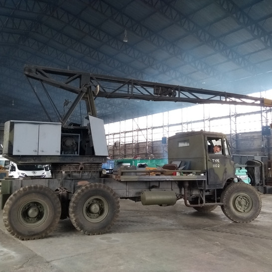 Hangar volunteer, Gary Millington moving the Thorneycroft Amazon Coles Crane into its new restoration spot in hangar 2. Image: Alan Jarden