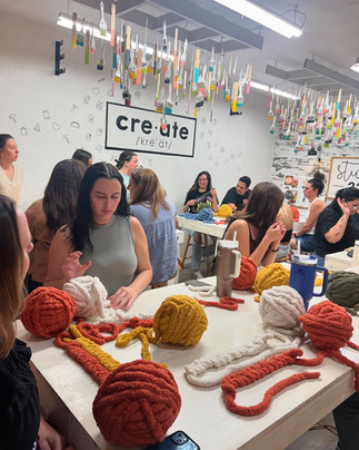 Participants creating chunky knit pumpkins at Studio 223 makerspace in Gilbert.
