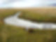 water flowing throuh a grassy channel