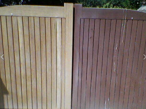 teo wooden gates side by side. one has been gently cleaned, the other shows the before 