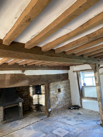exsposed wooden ceiling beams after being cleaned by our gently cleaning process