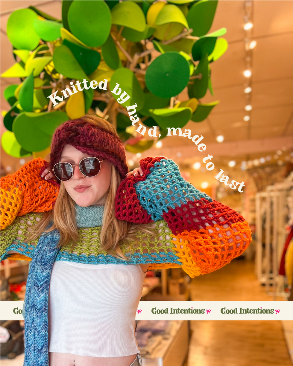 Girl in knitted outfit with text.