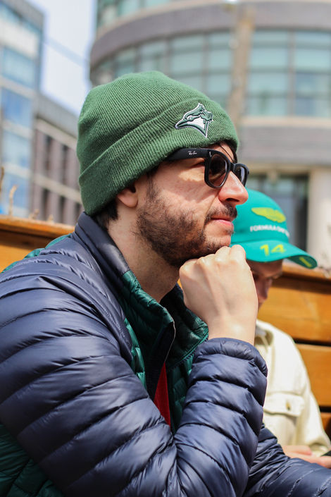 Man in Green Hat