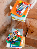 Notebooks, pens, pencils, and other essential items, ready for distribution to students at Ankadibevava Elementary School.