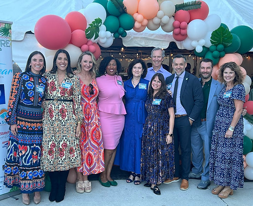 Board members for the Museum pose for a photo at the entrance to the Museum's Annual YachtVenture fundraiser