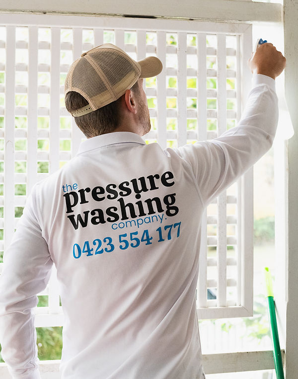Josh from The Pressure Washing Company cleaning external timber lattice at a property on Victoria Street, North Ward QLD 4810.